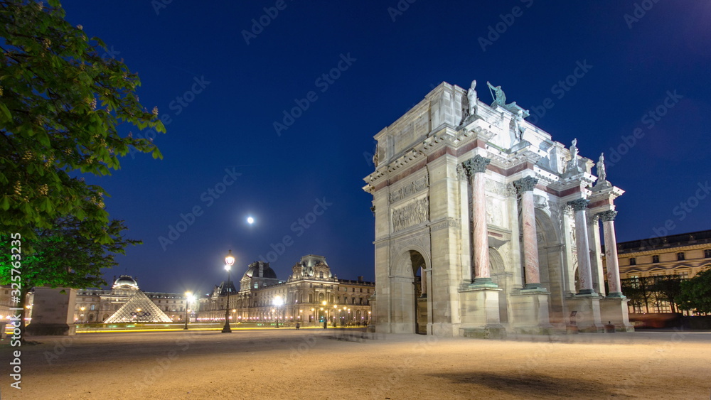 Obraz premium Illuminated Arc de Triomphe du Carrousel at night timelapse
