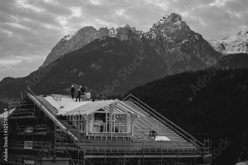 Wallpaper Mural Construction workers building chalet in the Swiss Alps Torontodigital.ca