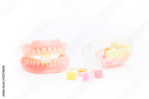 Jelly inserted into the denture isolated on white background.