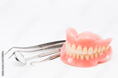 teeth and dental mirror, symbol photo of dentures, diagnosis and copayment