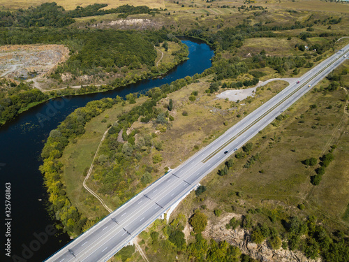 Car bridge over river Sluch near Novograd Volynsky, Ukraine photo