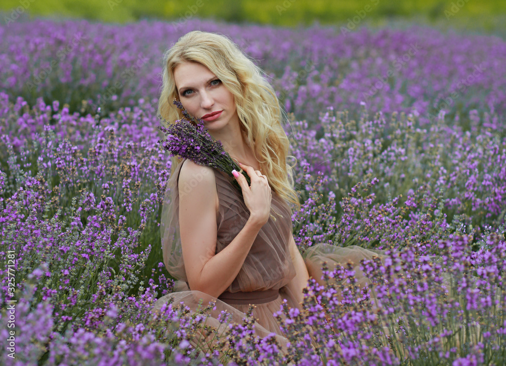 blonde girl in lavender field in summer enjoying vacation blonde girl in lavender field in summer enjoying vacation