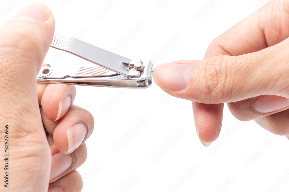 Close up cutting long fingernails and dirty using nail clipper, isolated on white background with clipping path, health care protection and cleanliness concept. Close up cutting long fingernails and dirty using nail clipper, isolated on white background with clipping path, health care protection and cleanliness concept.