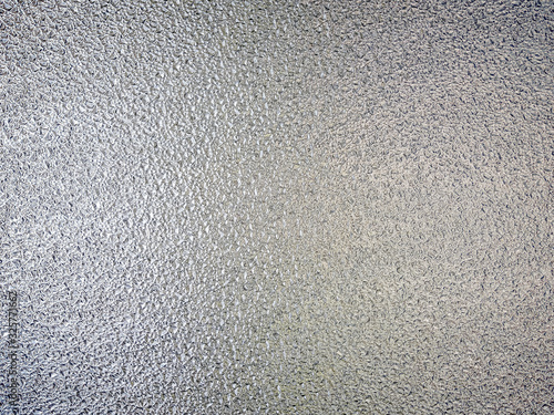 Grunge texture, frosted glass distressed silver effect with lighting back side.