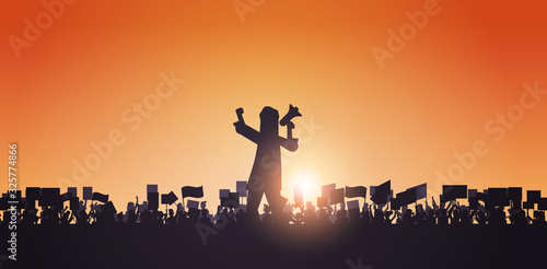 silhouette of man with megaphone over crowd protesters holding protest posters men women with blank vote placards demonstration speech political freedom concept horizontal portrait vector illustration