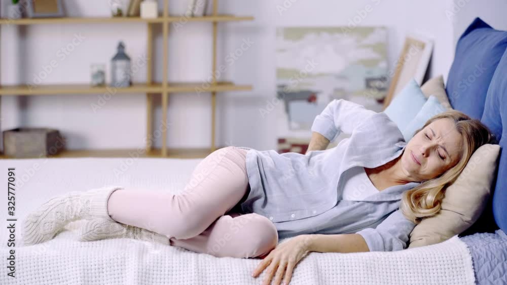 woman suffering from pain in back woman suffering from pain in back