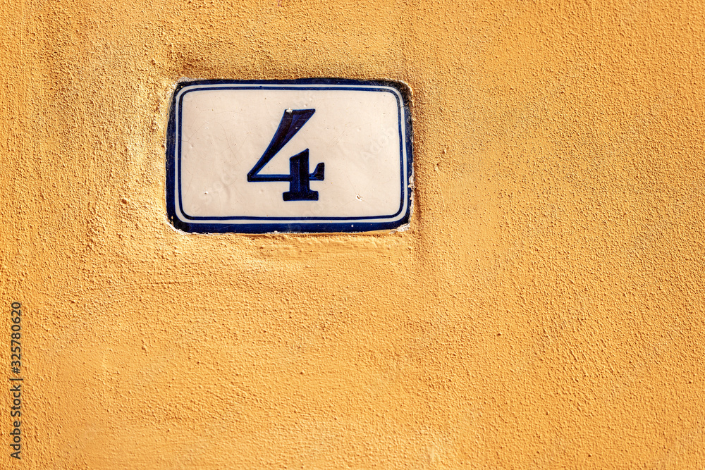 Old house number four on the orange wall, Bologna downtown, Emilia-Romagna, Italy, Europe Old house number four on the orange wall, Bologna downtown, Emilia-Romagna, Italy, Europe