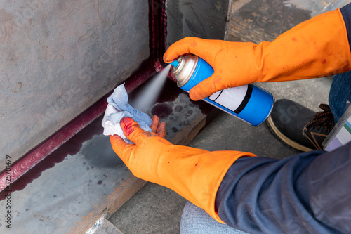 Step to use solvent remover spray into the rag to cleaning the welded surface before performing spray Liquid Penetrant for Non-Destructive Testing(NDT) with process Penetrant Testing(PT).