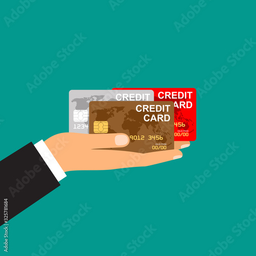 Man's hand holds credit cards