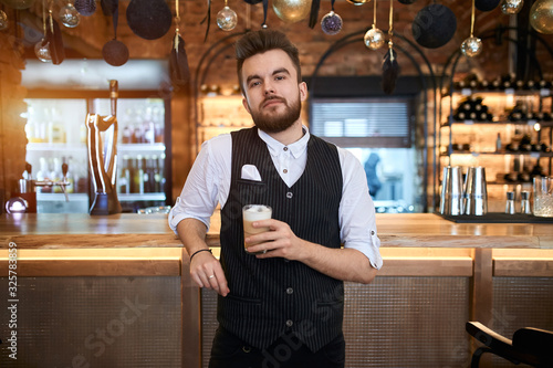 handsome guy preparing and serving different types of coffee.close up photo