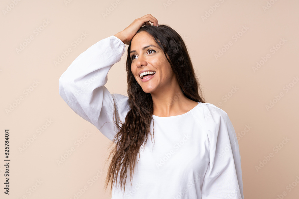 Young woman over isolated background laughing Young woman over isolated background laughing