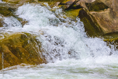 Fast flow of water in a mountain riverм_