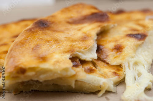 Khachapuri in Georgian. Khachapuri with cheese. Georgian traditional tortillas.
