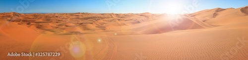 Big sand dunes panorama. Desert or beach sand textured background.