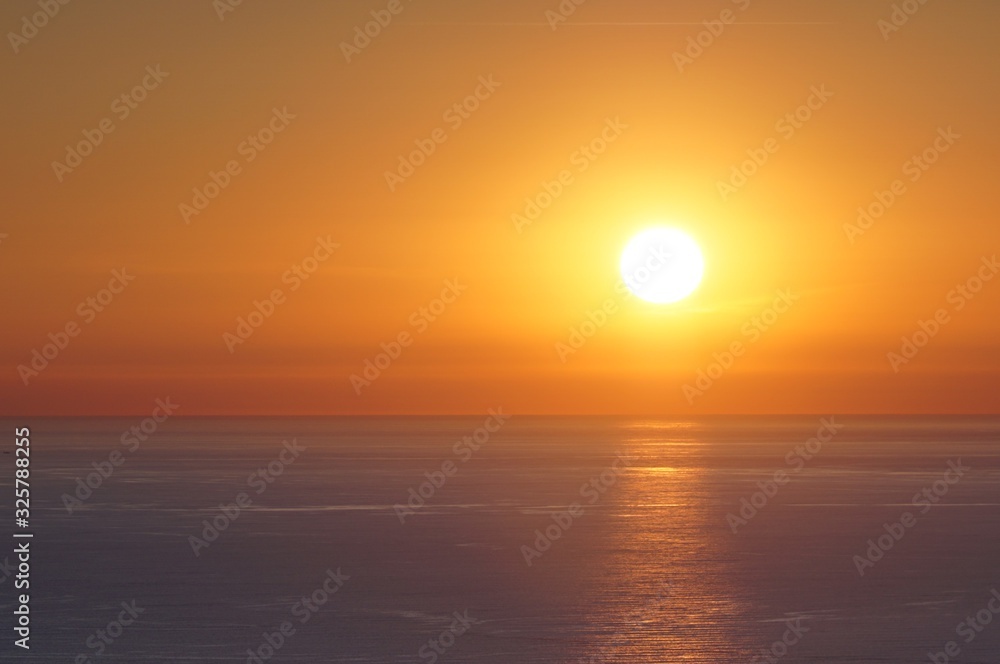 Sun sets over the sea in Versilia