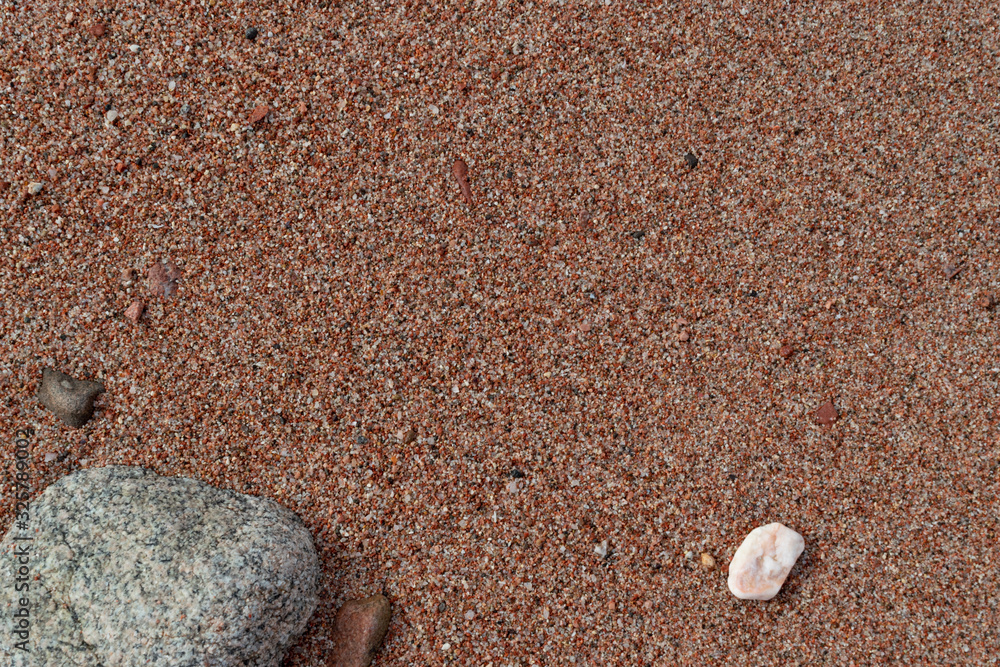 Red Sand and Stones of the red Sea Coast, Natural Texture Background Red Sand and Stones of the red Sea Coast, Natural Texture Background