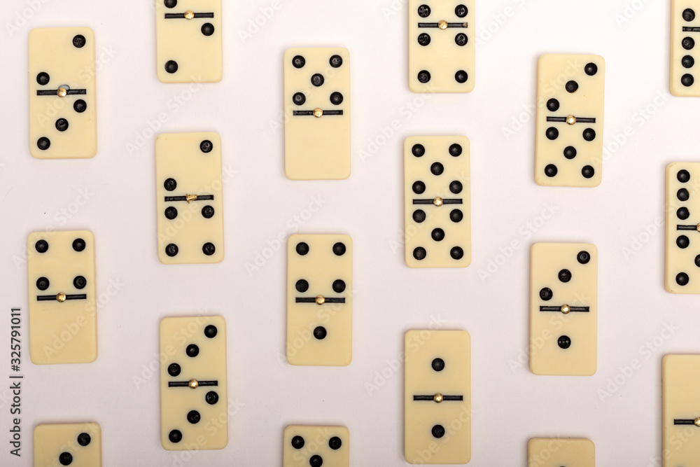 Photo of different dominoes. Background of dominoes. Hobbies collecting on white background. Photo of different dominoes. Background of dominoes. Hobbies collecting on white background.