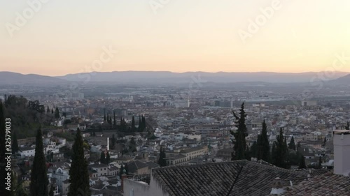 Beautiful Horizon in Granada, Spain. Amazing Sunset in La Alhambra with the city in the background. Cinematic Wide Shot of  landscape with mountains far away.