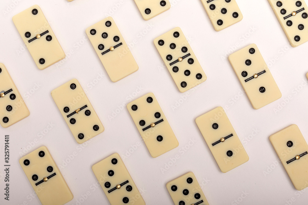 Photo of different dominoes. Background of dominoes. Hobbies collecting on white background. Photo of different dominoes. Background of dominoes. Hobbies collecting on white background.
