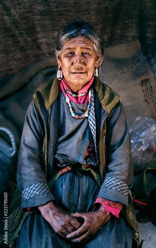 Nomadic old Woman. They live for several months a year in tents, looking for fresh pastures for their goats, from which comes cashmere wool. In Ladakh, Kashmir, India.