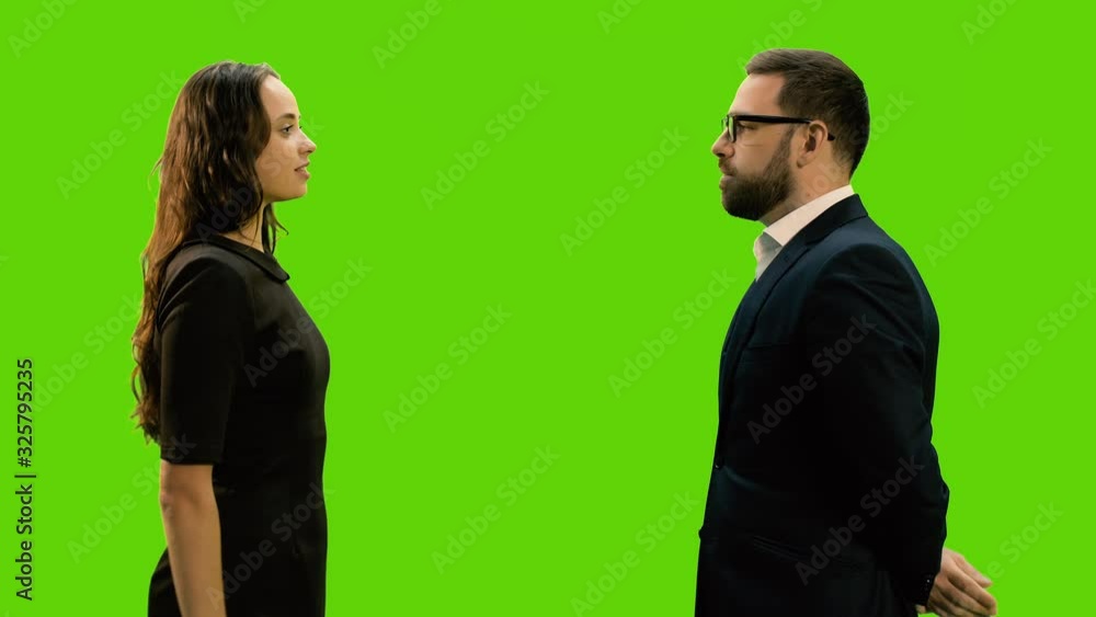 Two business partners shaking hands against green screen background, Chroma key, 4k pre-keyed footage Two business partners shaking hands against green screen background, Chroma key, 4k pre-keyed footage