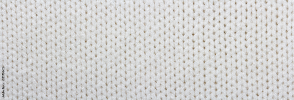 Knitted white fabric texture, stockinette stitch, macro Knitted white fabric texture, stockinette stitch, macro