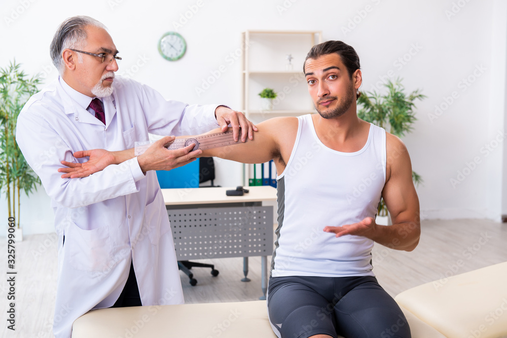 Young male patient visiting experienced doctor Young male patient visiting experienced doctor