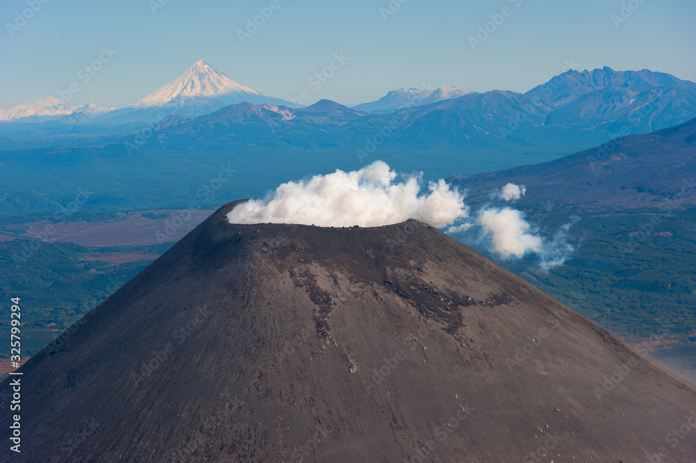 Active volcano, crater, smoke, steam, Kamchatka. 
