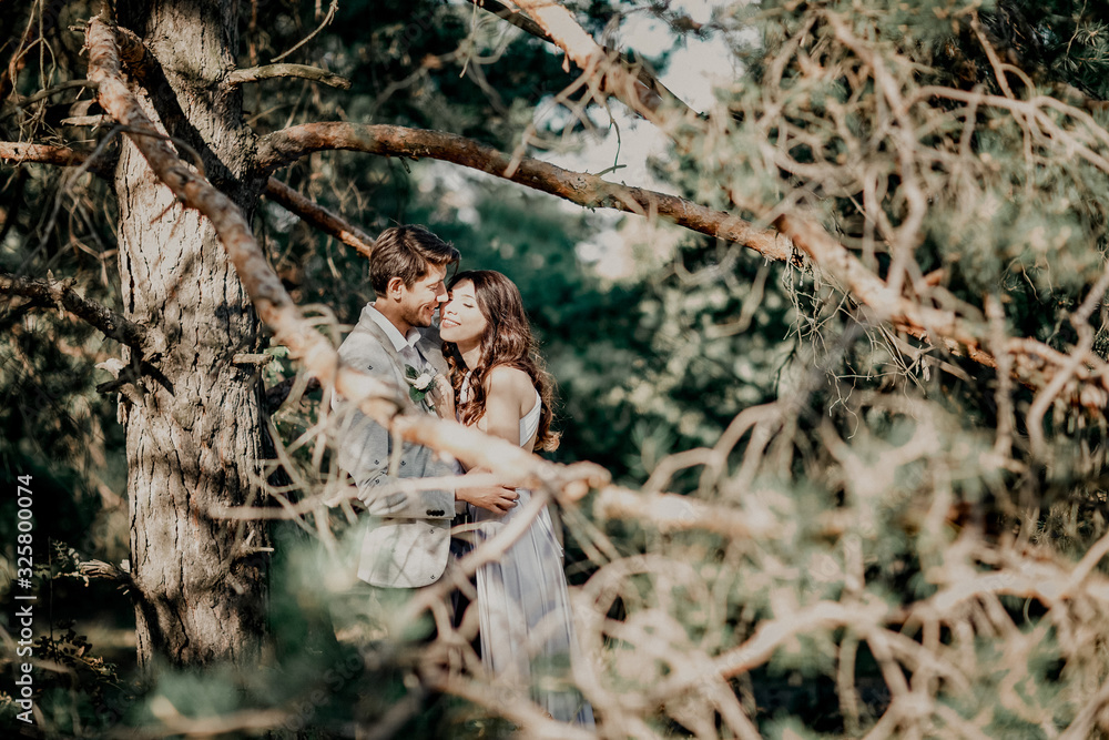 Kissing newlyweds couple. Outdoors wedding ceremony. Kissing newlyweds couple. Outdoors wedding ceremony.