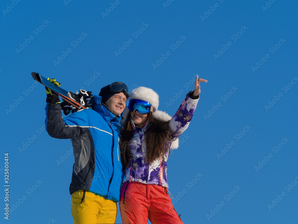 Couple on a ski resort. Sport, healthy and active lifesryle concept. Couple on a ski resort. Sport, healthy and active lifesryle concept.