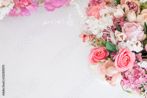 Feminine floral frame composition. Decorative web banner made of beautiful pink peonies. White background. Empty space. Flat lay  top view. Picture for blog