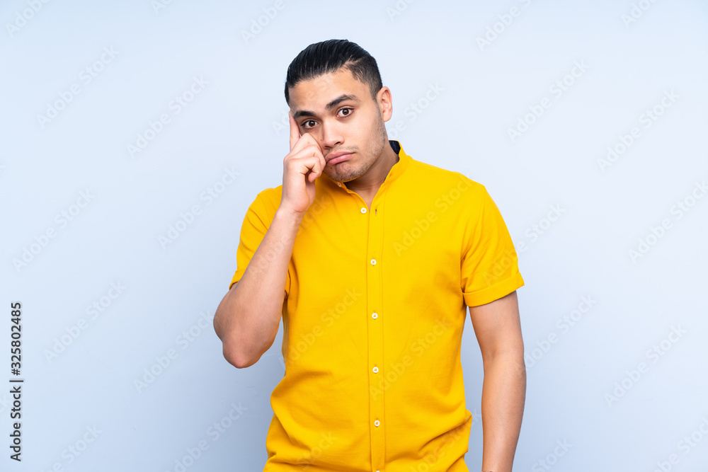 Asian handsome man over isolated background thinking an idea Asian handsome man over isolated background thinking an idea