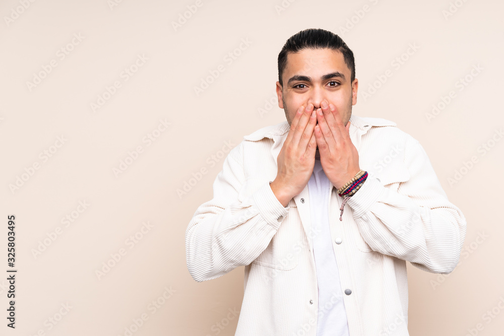 Asian handsome man over isolated background happy and smiling covering mouth with hands Asian handsome man over isolated background happy and smiling covering mouth with hands