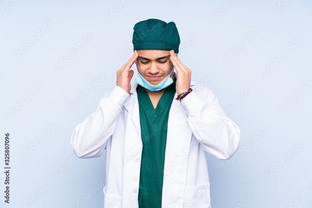 Surgeon man with uniform isolated on blue background unhappy and frustrated with something. Negative facial expression Surgeon man with uniform isolated on blue background unhappy and frustrated with something. Negative facial expression