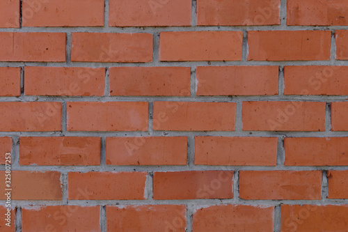 The surface of the rows of brick walls of red ceramic bricks