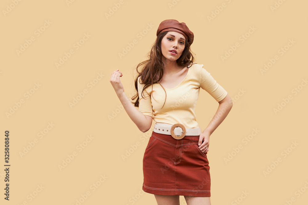 Young beautiful girl dressed in retro vintage style in the old european city