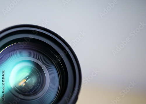 Fototapeta dslr zoom lens front view with copy space