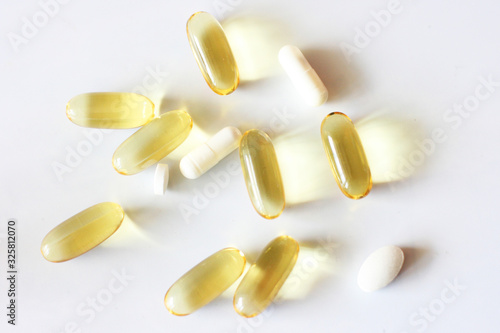Tablets and pills laying on table. Background for pharmacology. Medicament composition.