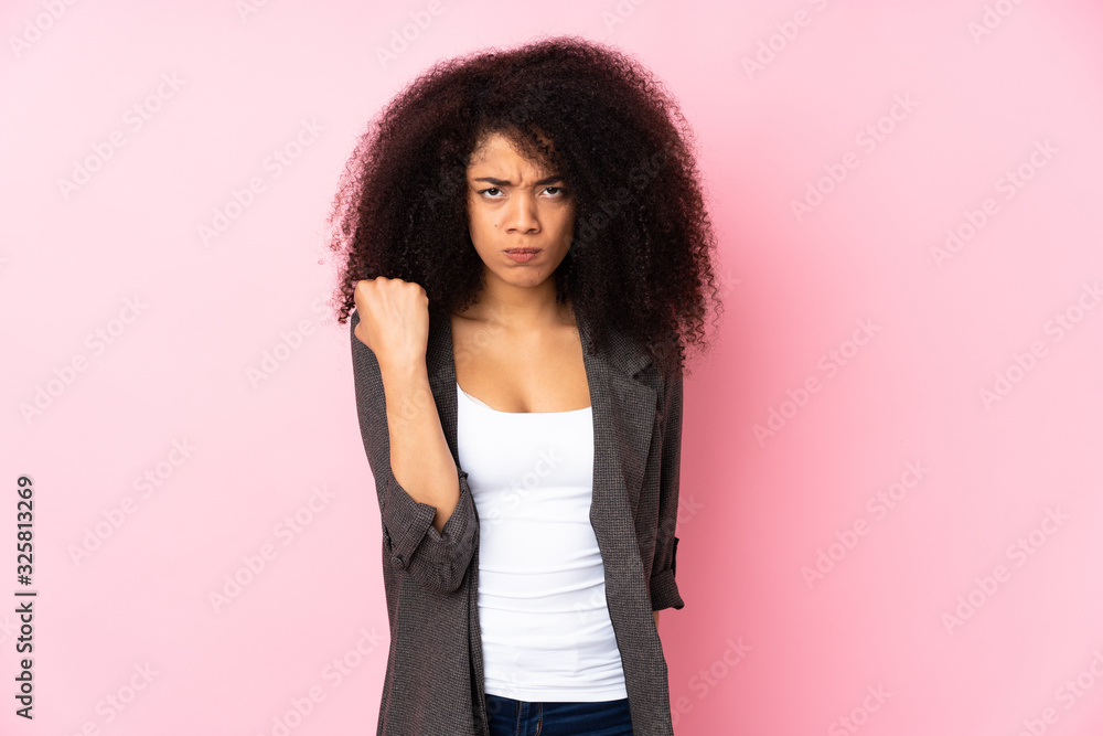 Young african american woman over isolated background with unhappy expression Young african american woman over isolated background with unhappy expression