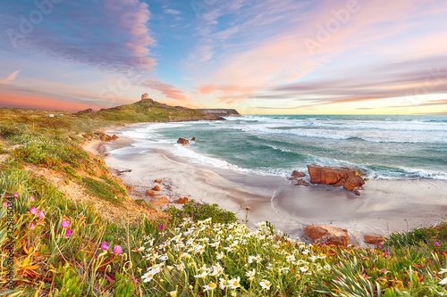 Fototapeta Naklejka Na Ścianę i Meble -  Dramatic  view of  Capo San Marco Lighthouse on Del Sinis peninsula.