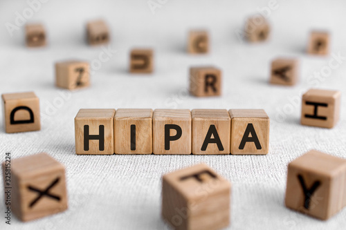 HIPAA - words from wooden blocks with letters, Health Insurance Portability and Accountability Act HIPAA concept, white background