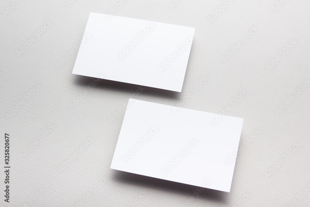 Business card blank on wooden background. Corporate Stationery, Branding Mock-up. Creative designer desk. Flat lay. Copy space for text Business card blank on wooden background. Corporate Stationery, Branding Mock-up. Creative designer desk. Flat lay. Copy space for text