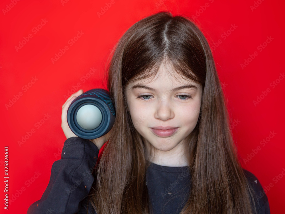 Fototapeta premium young girl holds a music column