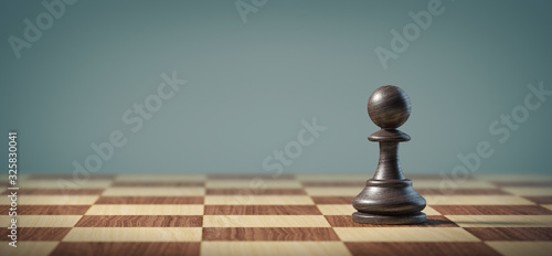 Black pawn on a chessboard.