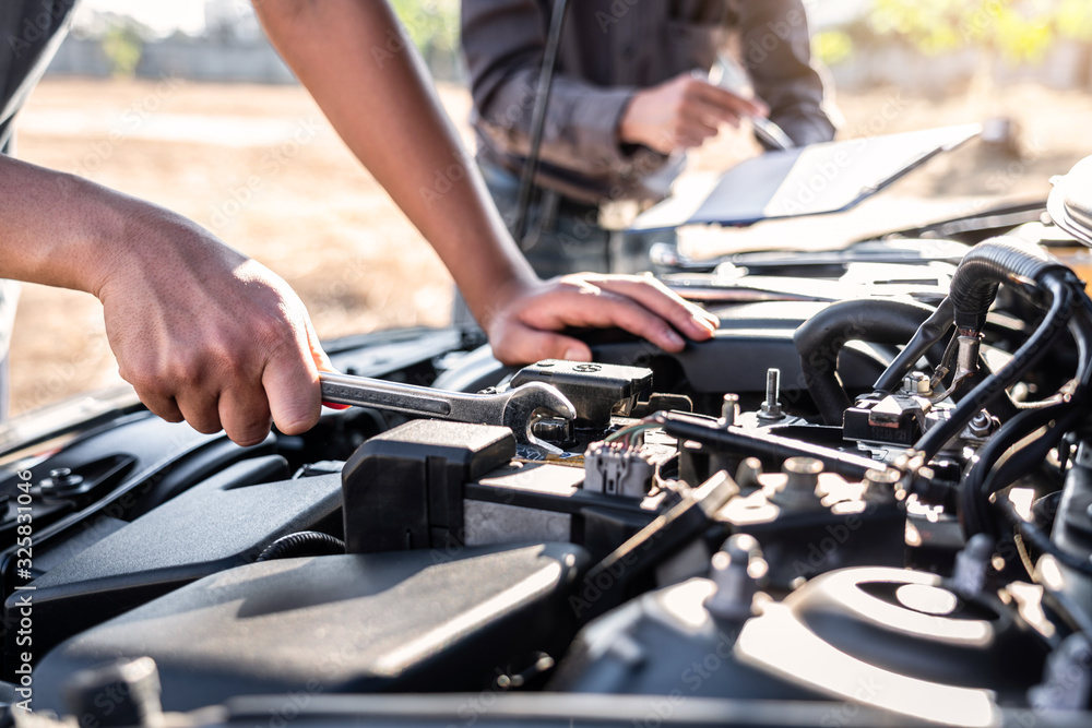 Technician team working of car mechanic in doing auto repair service and maintenance worker repairing vehicle with wrench, Service and Maintenance car check Technician team working of car mechanic in doing auto repair service and maintenance worker repairing vehicle with wrench, Service and Maintenance car check