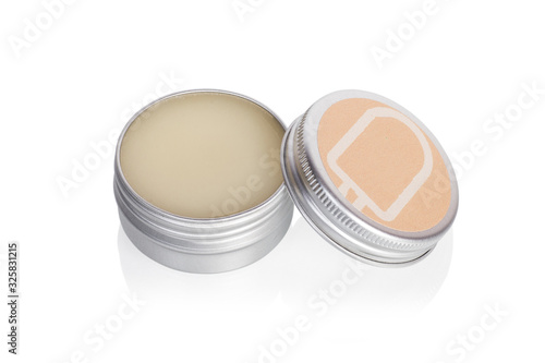 Lip balm in metallic tins isolated on a white background photo