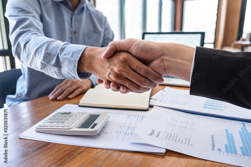 Finishing up a meeting collaboration, Handshake of two business people collaboration after contract agreement to become a partner of business making to successful and growth profit