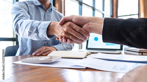 Finishing up a meeting collaboration, Handshake of two business people collaboration after contract agreement to become a partner of business making to successful and growth profit