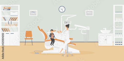 Interior of clinic: dentist's office with stylish medical equipment for dental treatment.Surgeon is talking to patient - little boy with Teddy bear.Products for oral hygiene in closet.Vector