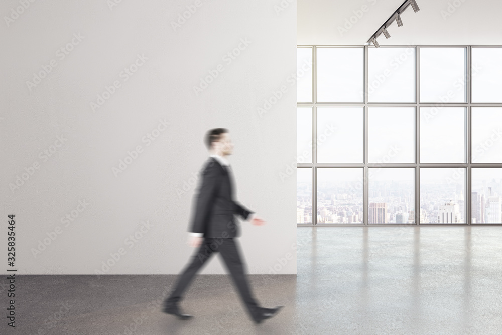 Fototapeta premium Businessman walking in modern interior